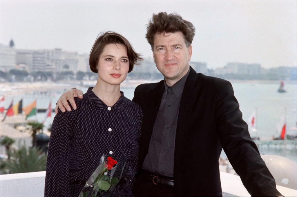 Italian actress Isabella Rossellini poses with American director David Lynch at the 43th edition of the Cannes Film Festival in Cannes, southern France, on May 19, 1990. 