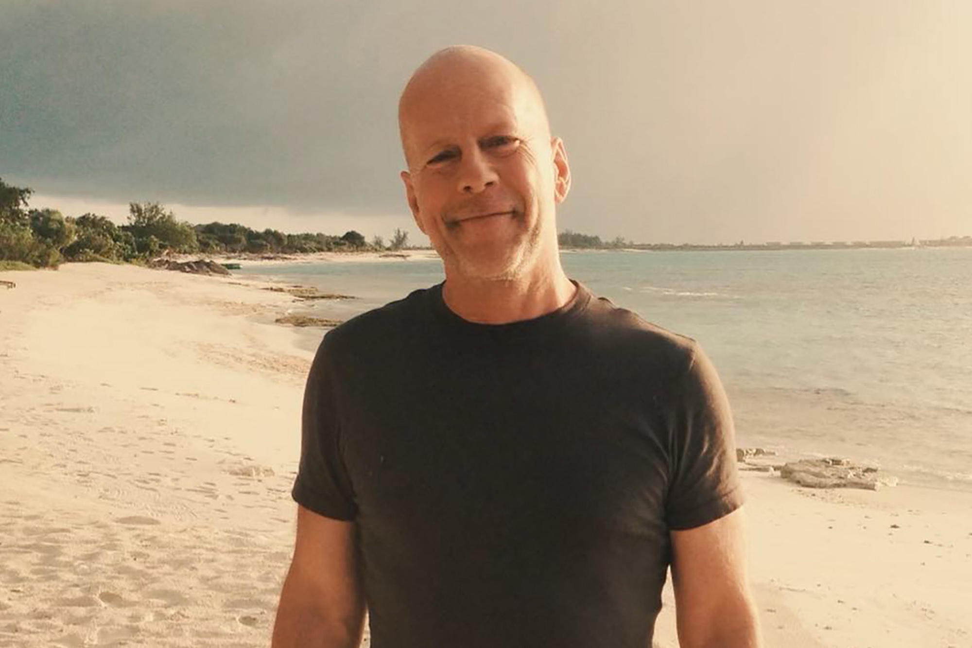 Bruce Willis on a beach